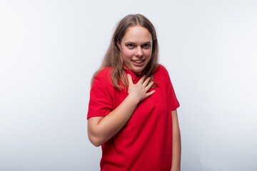 Kind teenage girl smiling and friendly against a background with copy space