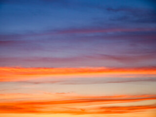 Natures canvas displaying an array of sunset colors, instilling peace and awe. Suitable for natural beauty promotions.