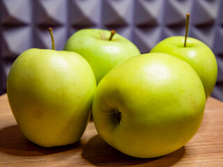 Vibrant apples, wood, grey pattern, dietary focus.