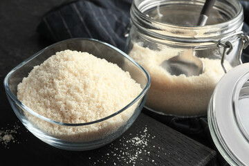Fresh almond flour on dark table, closeup