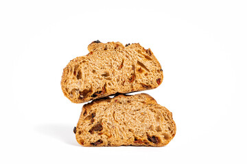 A loaf of sourdough bread with sun-dried tomato cut in half