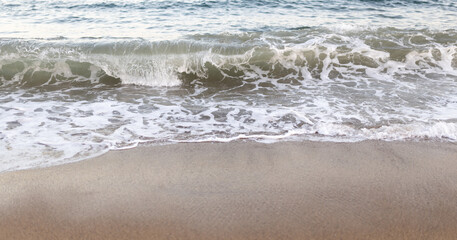 Blue ocean wave on sandy beach. Nature Background, summer time