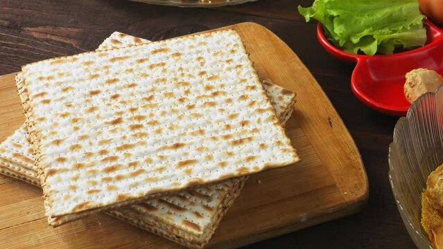 Matzo and kearah on the set table for the Pesach Seder meal. Vertical panorama