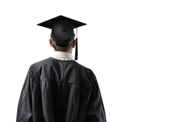 Rear view of a graduate in a black gown and cap, standing against a black background, symbolizing achievement and new beginnings.