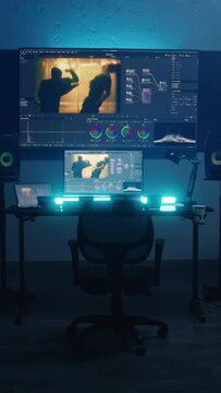 Studio with modern equipment for color correction. Computer, digital tablet and big screens showing color grading program interface with movie footage, RGB graphics and color wheels. Post production.