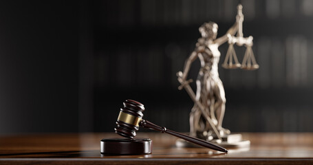 Legal Concept: Themis is the goddess of justice and the judge's gavel hammer as a symbol of law and order on the background of books