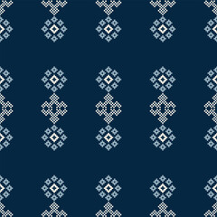 Naklejka premium Traditional black ethnic motifs ikat geometric fabric pattern cross stitch.Ikat embroidery Ethnic oriental Pixel blue background.Abstract,vector,illustration. Texture,decoration,wallpaper.