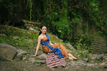 Asian woman wearing "Kemben" batik cloth