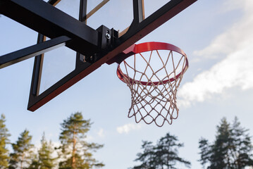 basketball hoop against blue sky