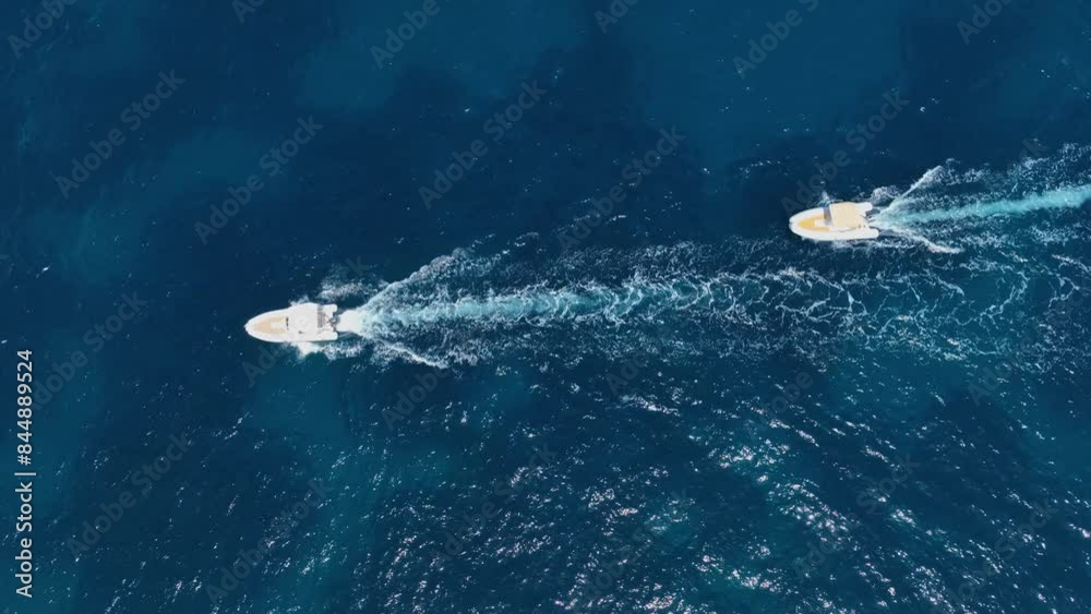 Sticker aerial view on fast boats on blue sea at sunny day. vacation and leisure. fast ship on the sea surfa