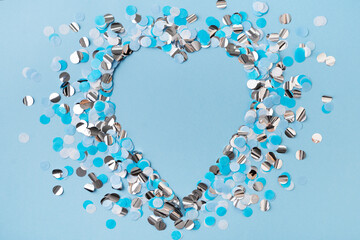 Heart shape confetti blue and sparkle on blue background