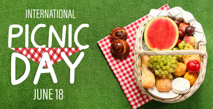 Wicker basket with tasty food for picnic on green background - Powered by Adobe