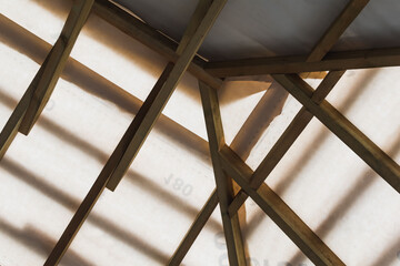 The frame of the roof of a new house under construction