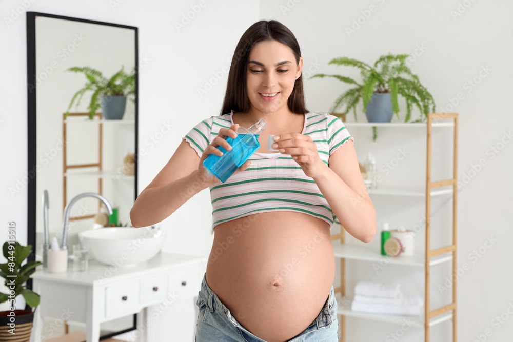 Sticker young pregnant woman pouring mouth rinse in white bathroom