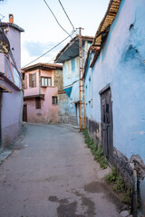 Naklejka premium Traditional Kula houses with wooden structure in Turkish and Ottoman architectural style, Manisa, Türkiye. Historical buildings and houses on the streets of Manisa.