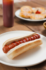 Hot Dog with Ketchup on White Plate
