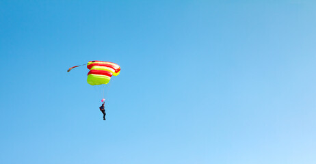 Solo Paraglider Against Clear Blue Sky
