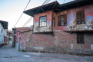 Traditional Kula houses with wooden structure in Turkish and Ottoman architectural style, Manisa, Türkiye. Historical buildings and houses on the streets of Manisa.