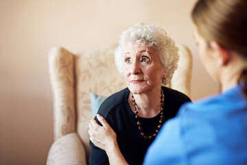 Senior, woman and sofa with caregiver for support in nursing home with kindness, empathy and...