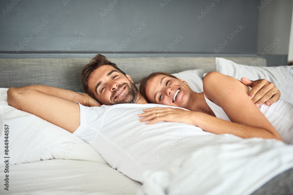 Wall mural smile, couple and portrait relax on bed in morning, peace or support for marriage commitment at hous