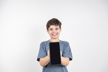 Smiling 10 year old Brazilian child with smartphone in hand_10.