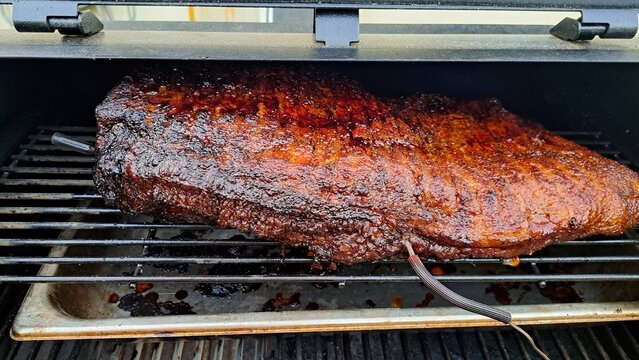 Beef brisket smoked on a charcoal or pellet smoker fat cap up