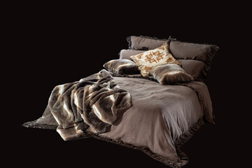 empty bed with brown blanket and pillows isolated