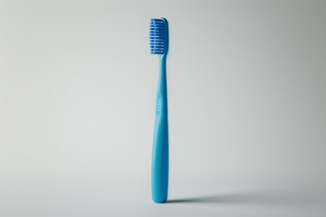 A bright blue toothbrush with soft bristles standing upright against a plain white background.. AI generated.