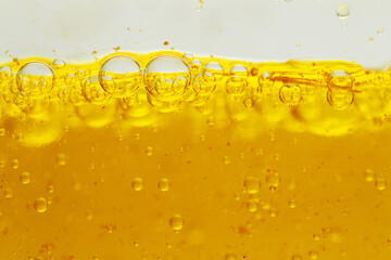 Macro shot of oil gelatin capsules dissolve in water