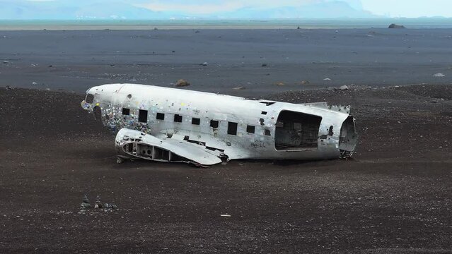 Aerial view of the Solheimasandur Plane Wreck in Iceland. Wrecked old plane Dakota on the black sand beach, south coast of Iceland
