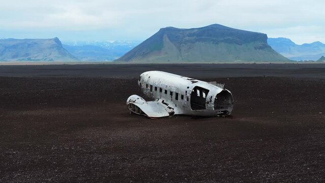 Aerial view of the Solheimasandur Plane Wreck in Iceland. Wrecked old plane Dakota on the black sand beach, south coast of Iceland
