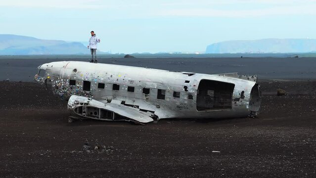 Aerial view of the Solheimasandur Plane Wreck in Iceland. Wrecked old plane Dakota on the black sand beach, south coast of Iceland