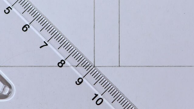 Close-up pencil drawing 45 degree angle line across another line plastic Set Square white paper copy space 