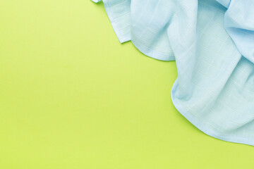 Cotton fabric on color background, top view