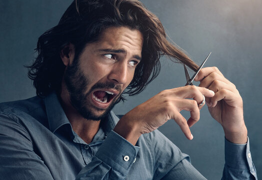 Trim, hair humor and man with scissors for grooming, facial cleaning and funny joke on grey studio background. Barber, mistake and face of scared model trimming fear for comedy cosmetic fail look