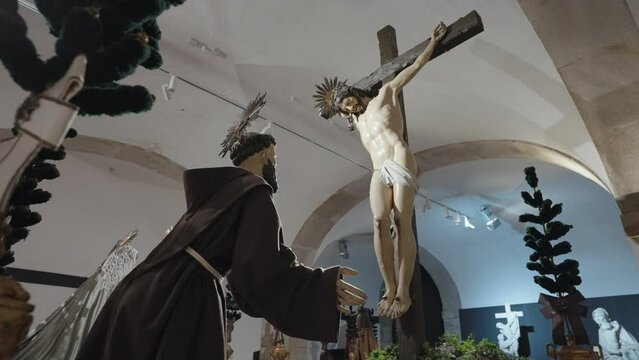 Porto, Portugal - April 8, 2024: The statues of Jesus and Saint Francis inside the Catacombs of Igreja de S&atilde;o Francisco, Porto