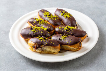 Traditional french eclairs with chocolate.