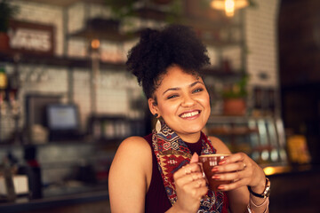 Woman, portrait and happy with coffee in cafe, beverage and casual for break. Female person, smile and drinking with mug at barista for relaxation, diner and cozy with tea for weekend at restaurant