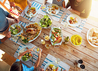 Table, food and above of family for lunch, supper and eating meal at home together. Celebration,...