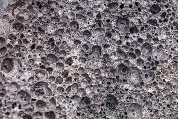 Vesicular texture is a volcanic rock texture characterized by a rock being pitted with many...