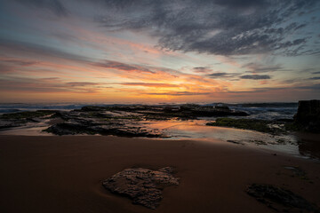 Obraz premium Sunrise at the beach on a summers morning