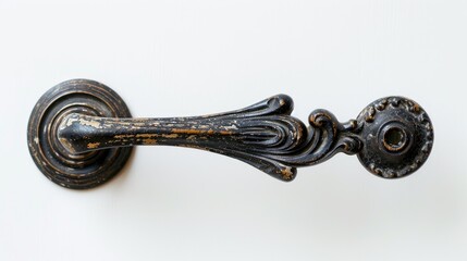 Obraz premium Antique black door handle on a white background with space for text