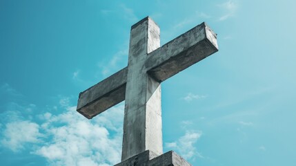 Concrete cross against blue sky