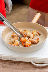 Frying prawns in a pan, well cooked