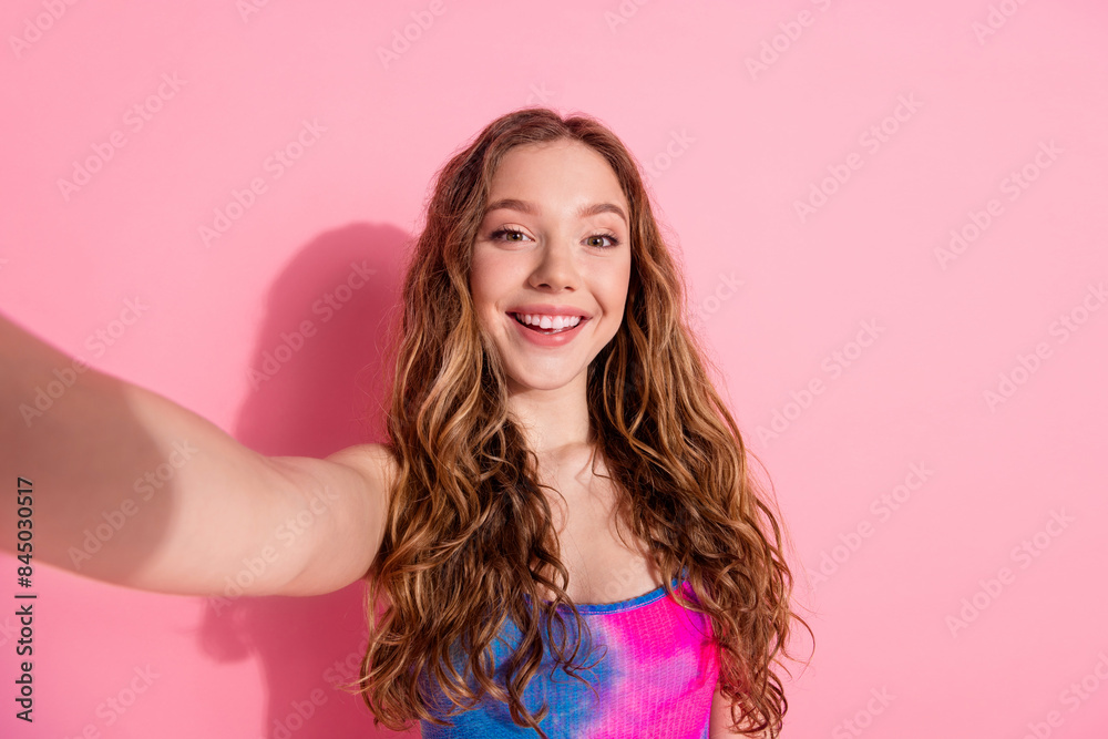 Wall mural Photo of charming positive girl wear retro outfit tacking selfie empty space isolated pink color background