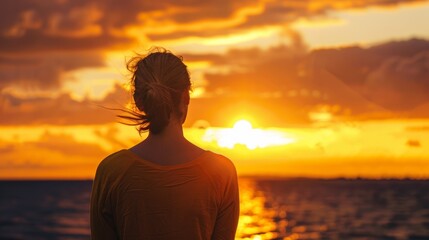 Fototapeta premium woman looking at the horizon as the sun sets generative ai