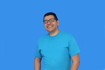 A 40-year-old dark-skinned Latino man uses eyeglasses to see better because he suffers from myopia...