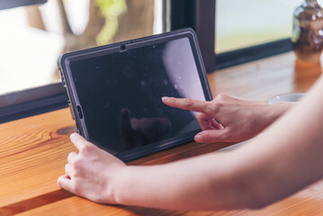 Woman hands using smartphone digital technology tablet empty blank screen. Close up Hands women holding smart tablet touch screen shopping online, call. Woman using mock up mobile at home office