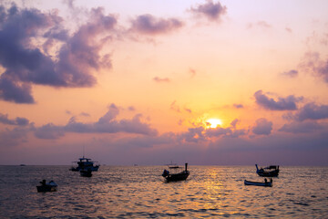Boat sea at Kalim Beach  twilight time sky and sunset in summer Phuket Thailand