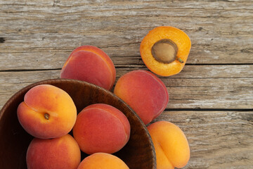 Group of fresh apricots isolated on rustic wooden table